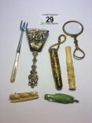 A mixed lot including Dutch caddy spoon, cheroot holder, silver fork,