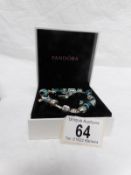 A replica Pandora style charm bracelet in box