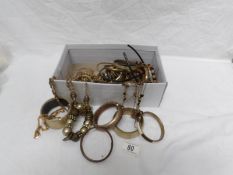 A mixed lot of yellow metal costume jewellery