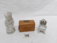 A crested figure 'Devil Looking over Lincoln', a Boston chair and a Mauchlin ware Mablethorpe box