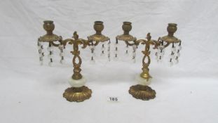 A pair of gilded candelabra