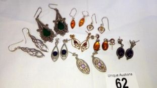 9 pairs of silver earrings