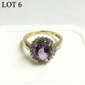 An amethyst and diamond cluster gold set ring,