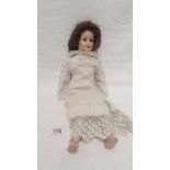 A 19th century doll with composition body