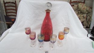 A coloured glass decanter & 6 glasses