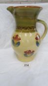 A large hand decorated pottery jug