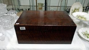 A large wooden lidded box