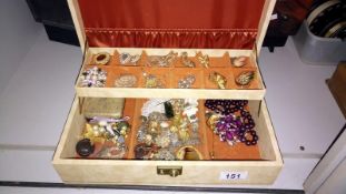 A jewellery box containing assorted costume jewellery