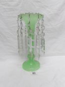 A green glass lustre with crystal droppers