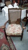 An Edwardian carver chair with a wicker back