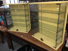 A pair of 1970s glass displays cabinets