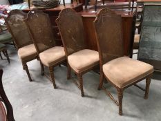 A set of 4 dining chairs with wicker backs