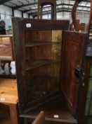 A 19th C oak corner cupboard