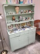 A shabby chic painted kitchen dresser