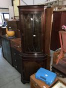 A mahogany corner cupboard