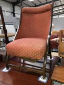 An Edwardian folding nursing chair