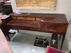 A Victorian mahogany spinnet converted to a desk