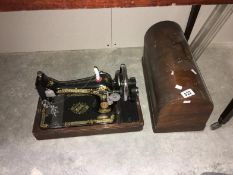 A cased Singer sewing machine