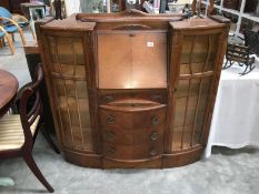 A 1930s oak combination butreay display cabinet