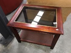 A glass topped coffee table