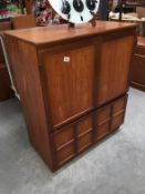 A teak effect TV cabinet