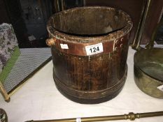 An old milk bucket with copper top surround