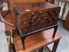 A free standing consertina sewing box