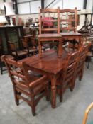 A heavy teak dining table and 6 chairs