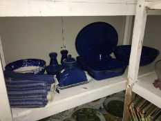 A collection of blue Denby dinner ware