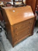 A 1930s light oak bureau