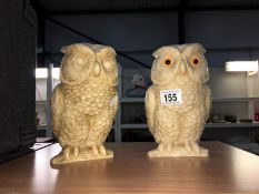 A pair of resin owls