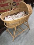 A wicker crib on stand