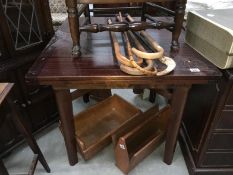 A dark wood draw leaf table