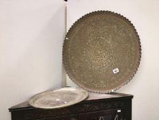 A large round Indian tray anmd 1 other