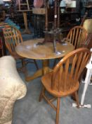 A pine drop leaf table and 3 chairs