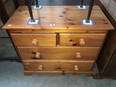 A solid pine 2 over 2 chest of drawers