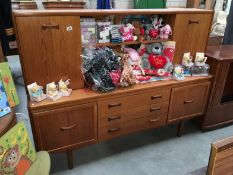 A teak sideboard wall unit