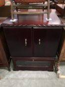 A dark wood stained TV cabinet