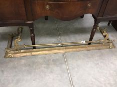 A Victorian brass fender