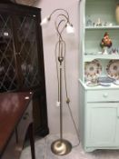 A antique brass effect standard lamp