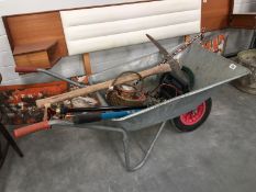 A galvanised wheelbarrow and contents