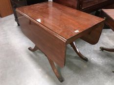 A mahogany drop leaf table