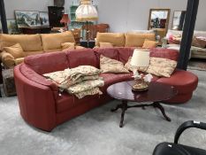 A brick red leather corner settee