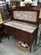 A marble topped mahogany wash stand with inlay