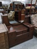 A 1930s oak mirror backed dressing table