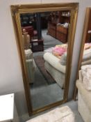 A large gilt framed bevel edge mirror