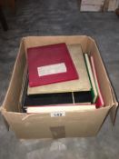 A box of stamp albums (empty)