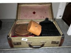 A small suitcase containing leatherware etc