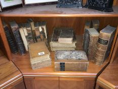 A quantity of antique leather bound books