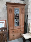 A satin walnut combination wardrobe with drawers